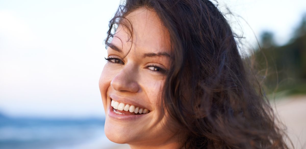Woman smiling confidently with healthy white teeth