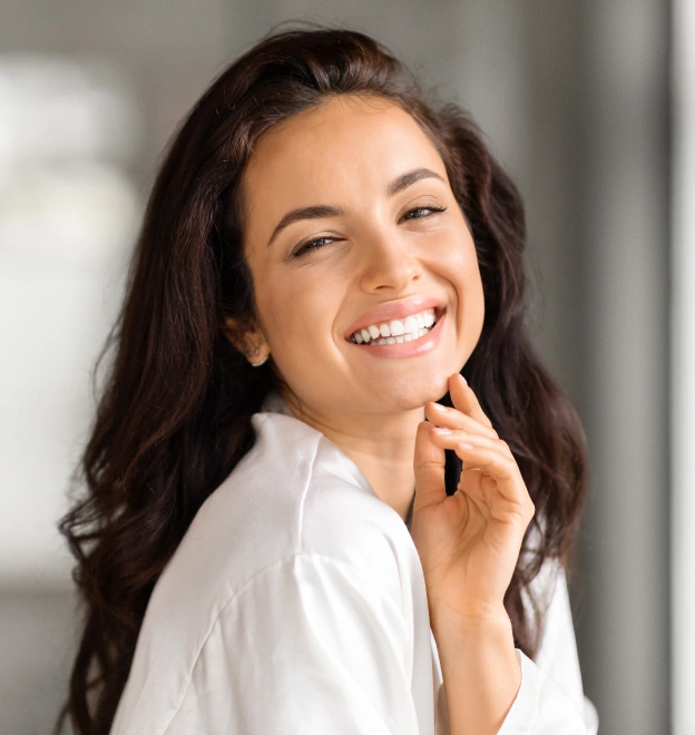 A woman smiling confidently