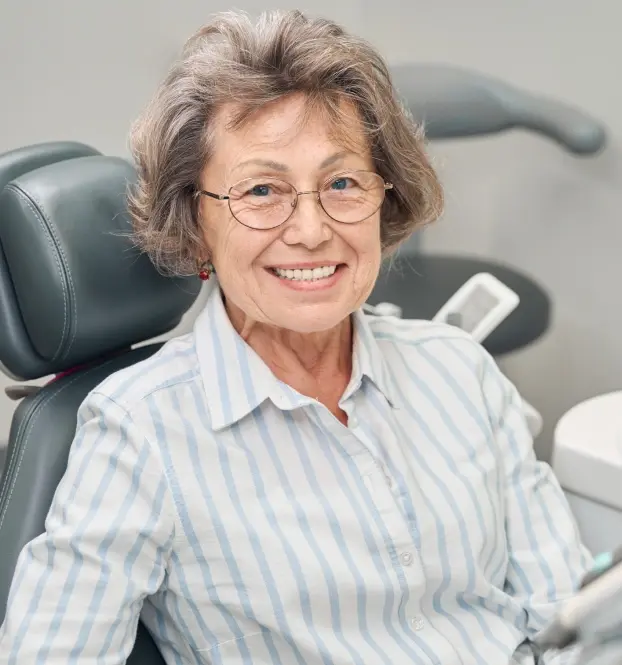 Elderly woman sitting in a dental chair