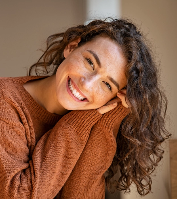 Woman with curly hair smiling